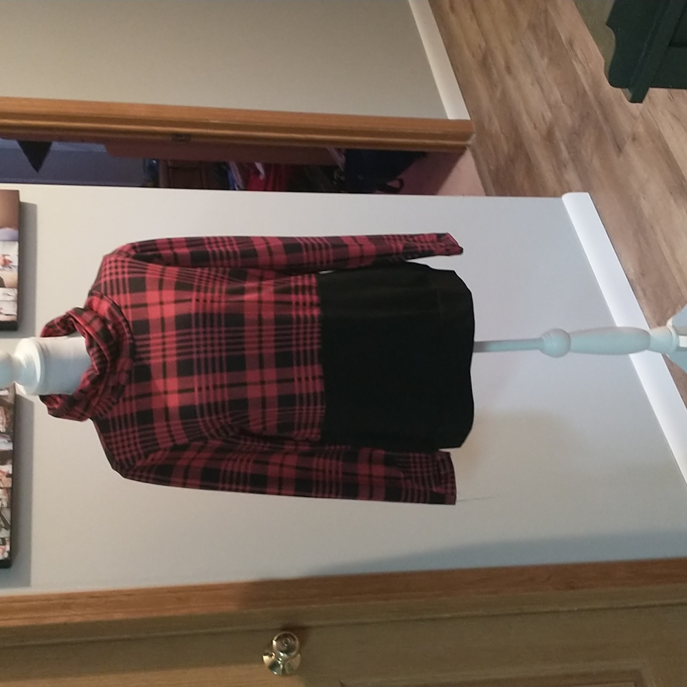 Plaid and black turtle neck top.
